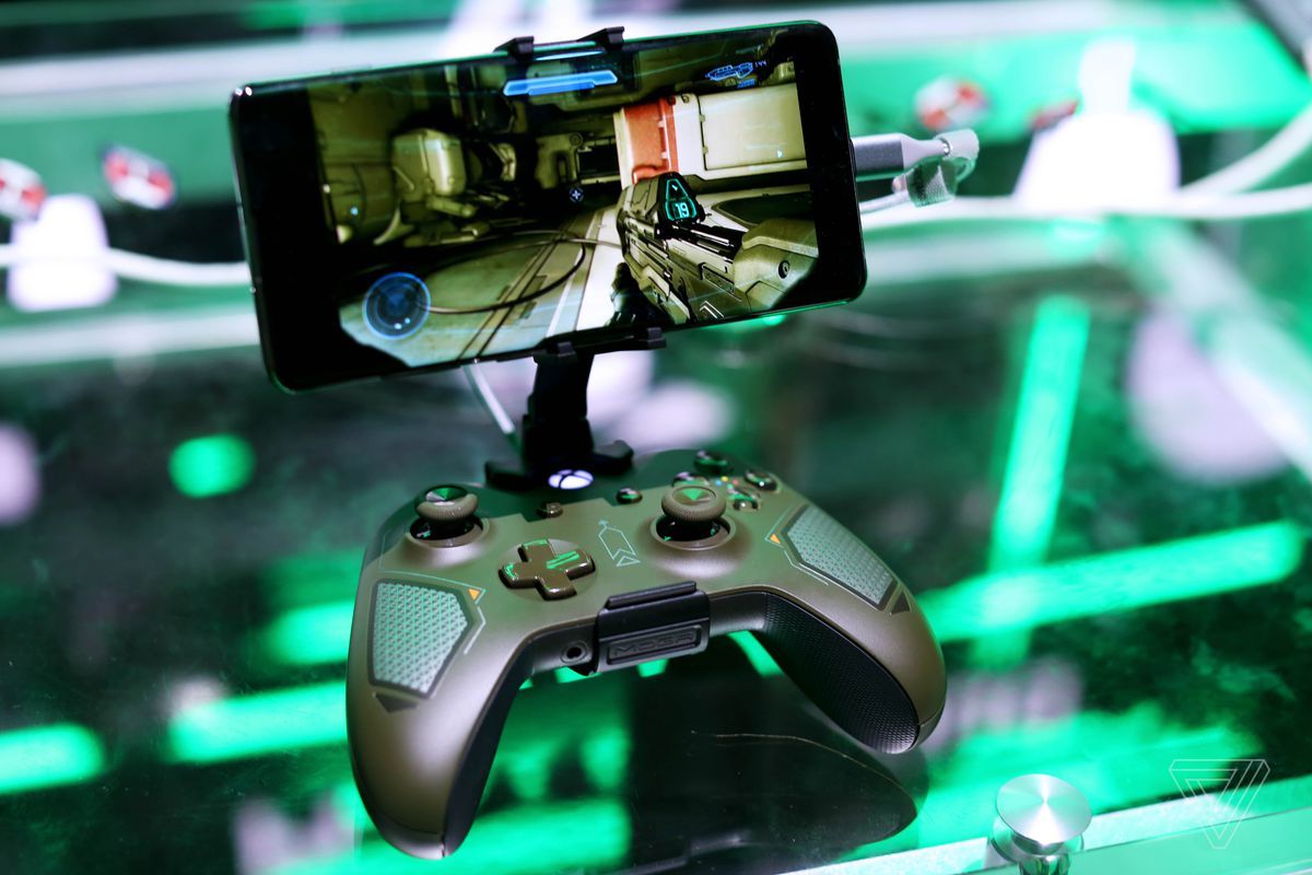 An Xbox controller attached to a cellphone playing a first person shooter.