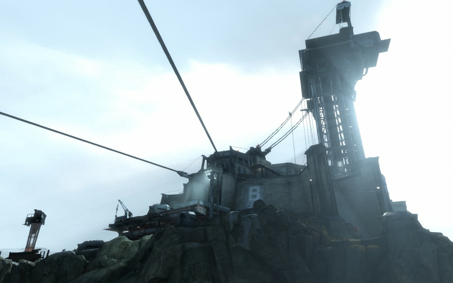 Screenshot from the game. Depicts a mountaintop facility covered in tethering cables.