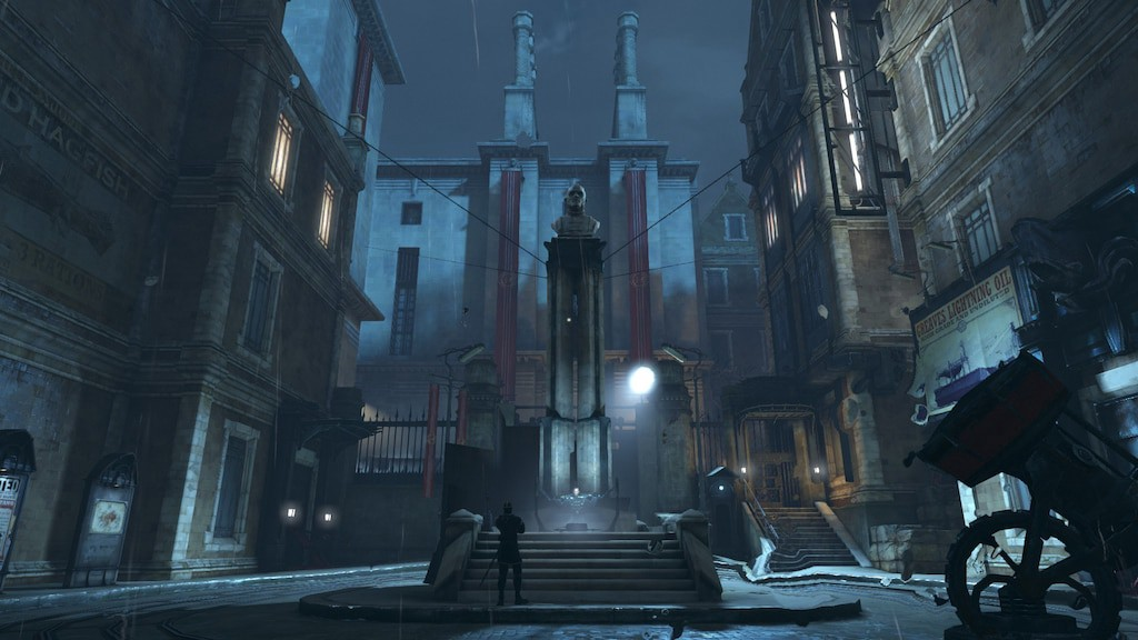 Screenshot from the game. Depicts a town square with an imposing concrete building in the background, and searchlights penetrating the darkness.