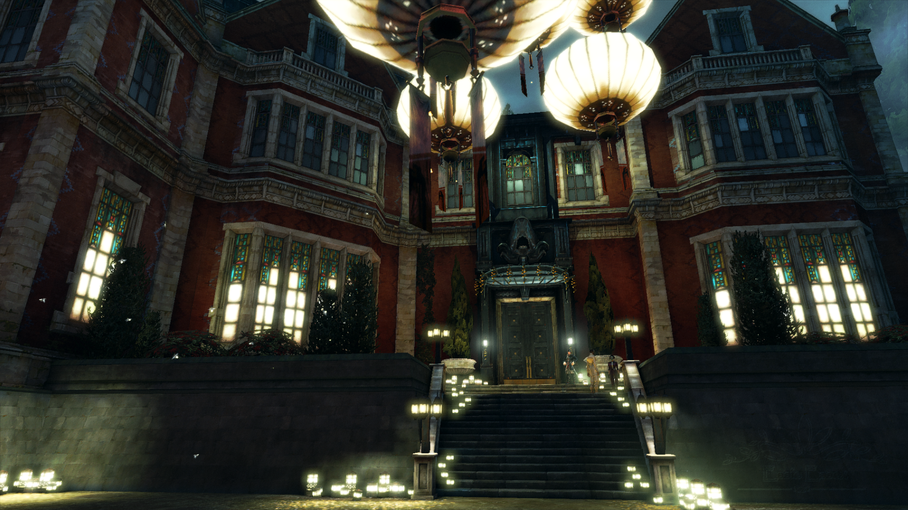 Screenshot from the game. Depicts a large red brick mansion at night, lit up from the inside.