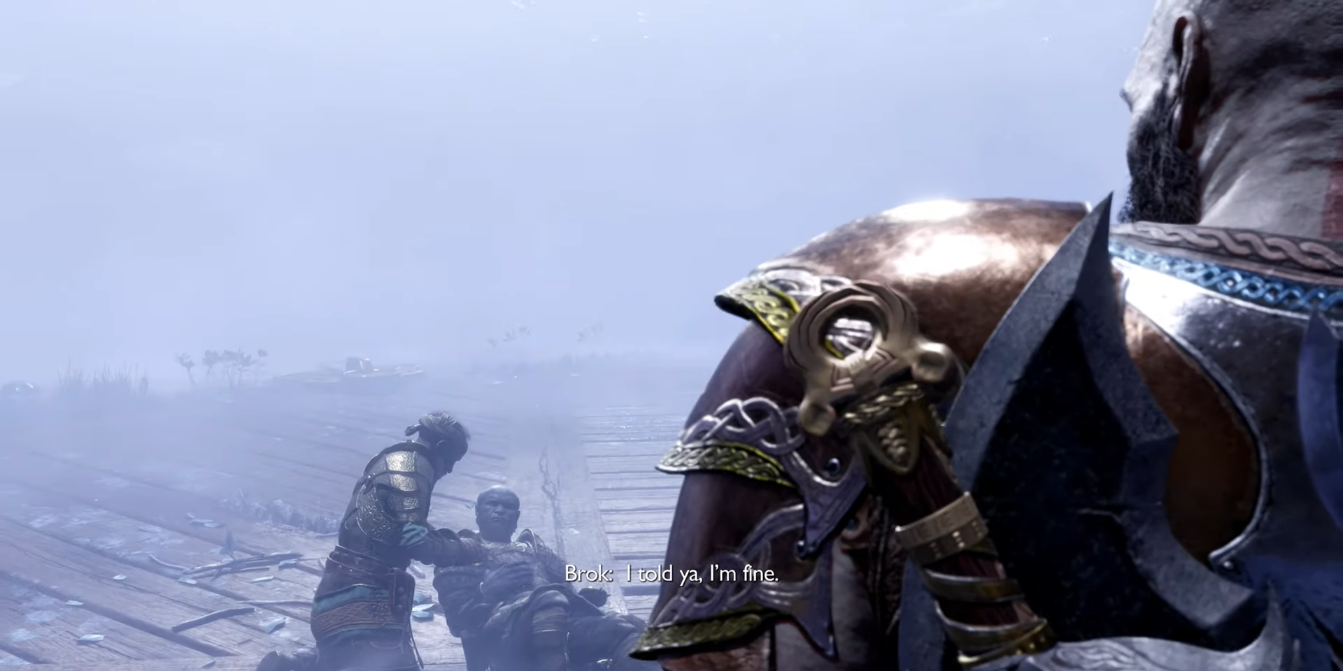 Screenshot. Brok lies on the ground, telling Sindri, "I told ya, I'm fine." Kratos looks on.