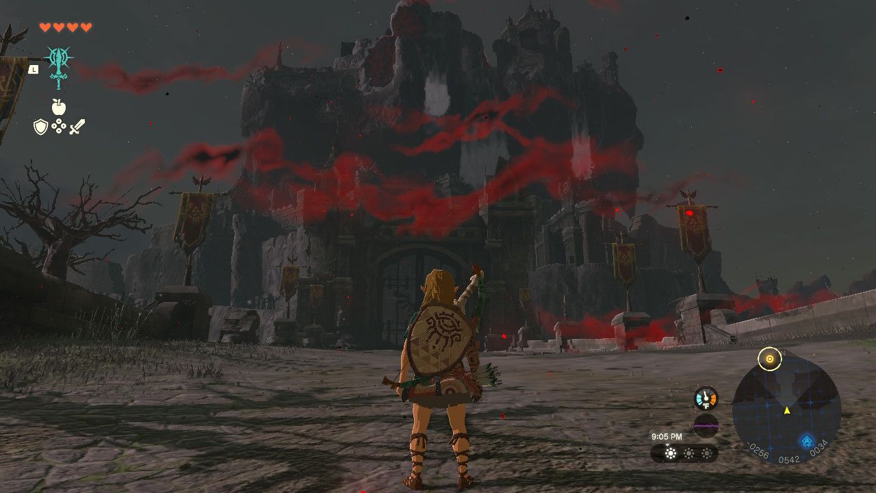 Link stands in front of the risen Hyrule Castle, which is wreathed in Gloom.