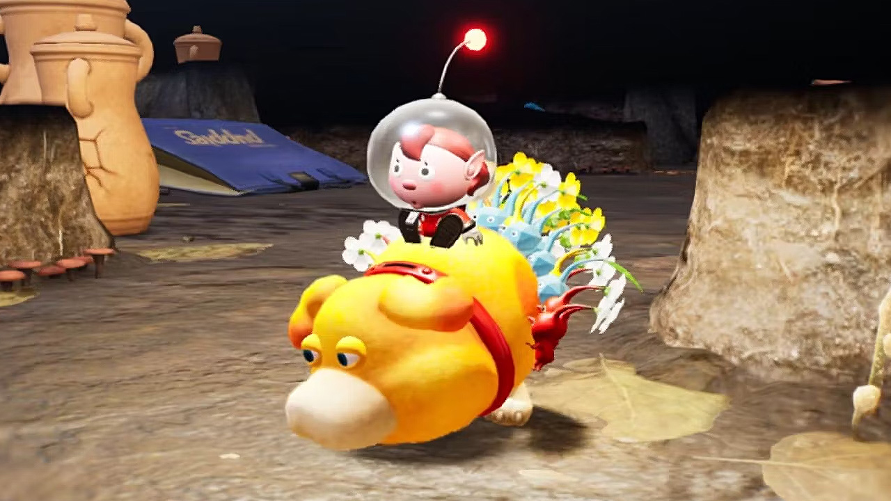 The player character rides with his Pikmin on the back of Otachi in a dark cave area.