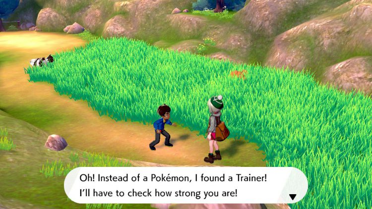 A screenshot of Pokemon Violet/Scarlet. A Trainer stops the player and challenges them to a fight.