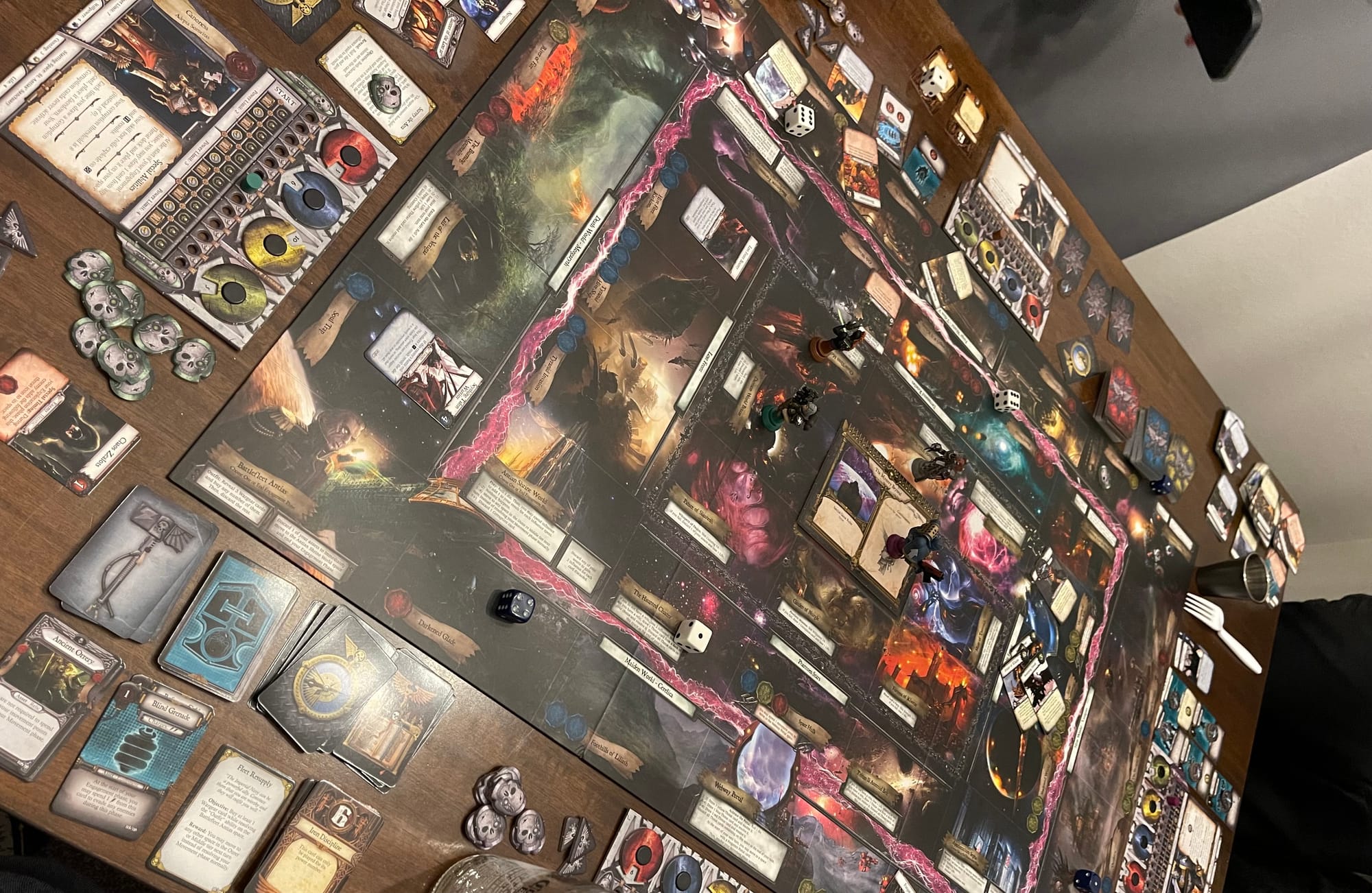 An overhead shot of the Relic gameboard, cards, and tokens set up on a table.