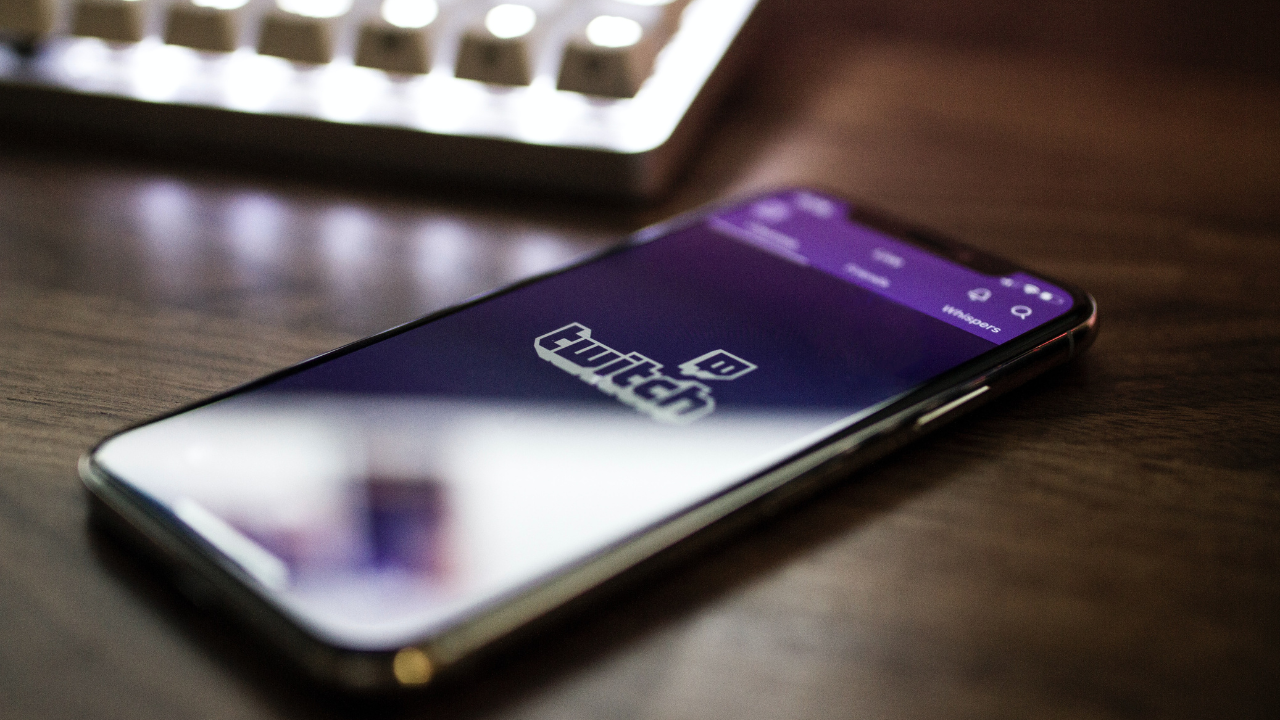Image of phone on desk with Twitch App open.