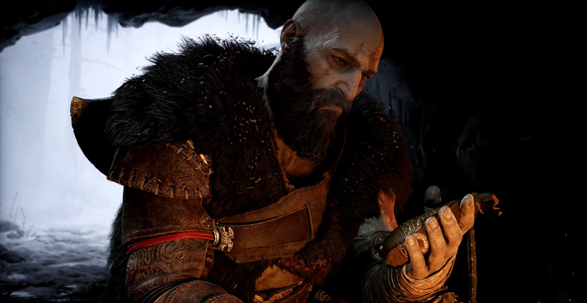 Screenshot of Kratos contemplating a pouch in his hand.