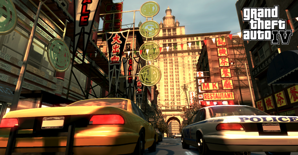 Promotional art for Grand Theft Auto 4; a police car and taxi cab rive through Liberty City in the sunset.